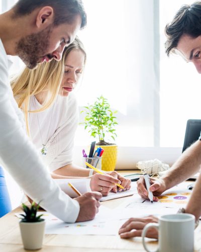 Team collaborating around a desk